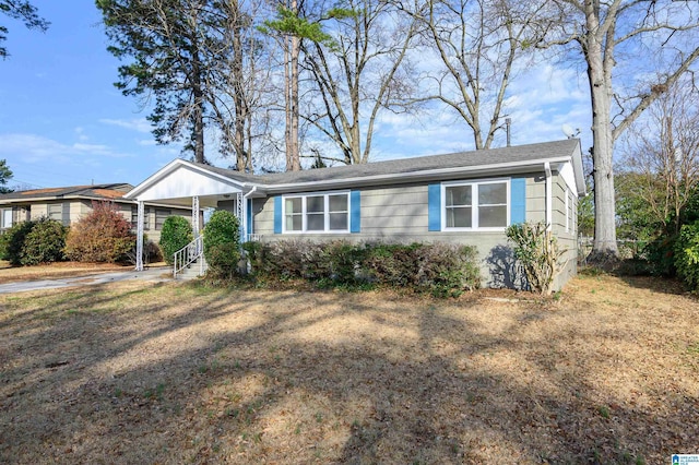 ranch-style house featuring an attached carport