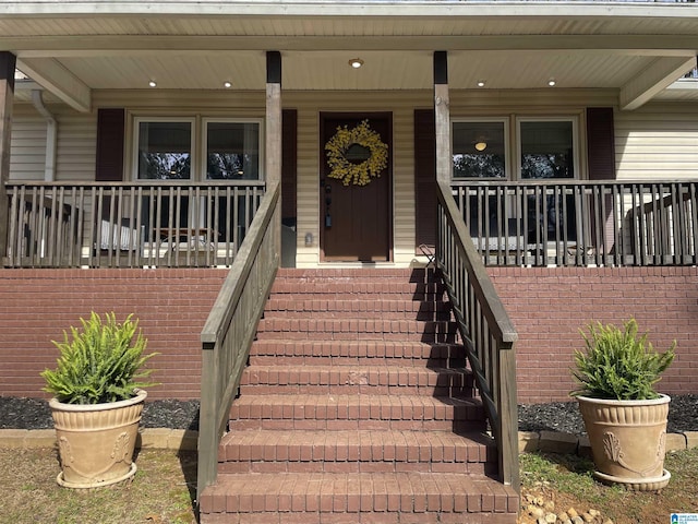 entrance to property with a porch