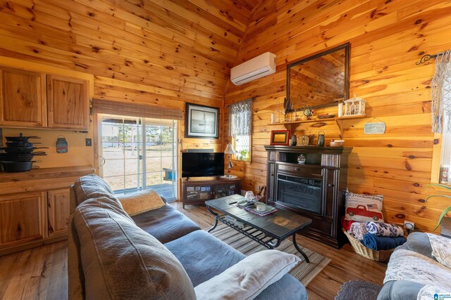 72 Alexandria Heights Cir, Alexandria, AL 36250 - living room with light wood-style floors, an AC wall unit, and wood walls