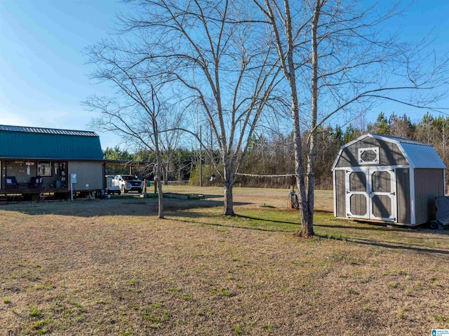 view of yard with an outdoor structure and a storage unit