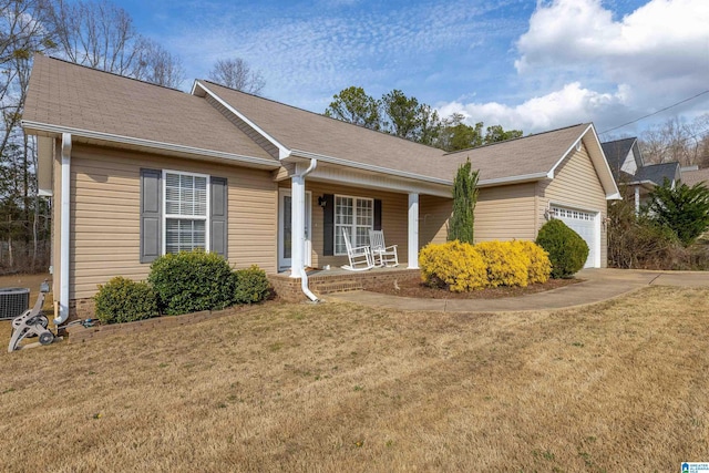 single story home with a garage, driveway, a porch, a front lawn, and central AC