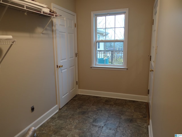 interior space featuring baseboards