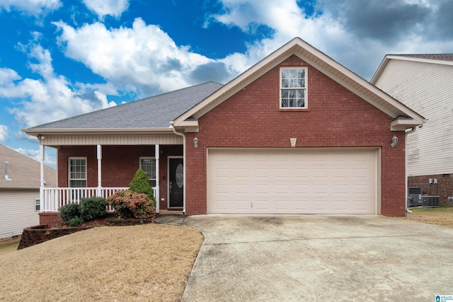 view of front of property featuring covered porch, driveway, brick siding, and a shingled roof