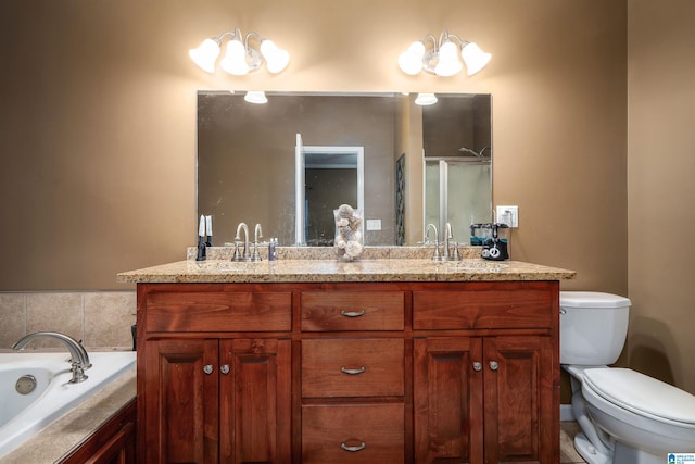 bathroom with a garden tub, a sink, toilet, and double vanity