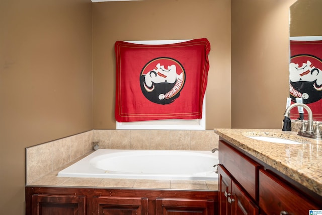 bathroom with vanity and a whirlpool tub