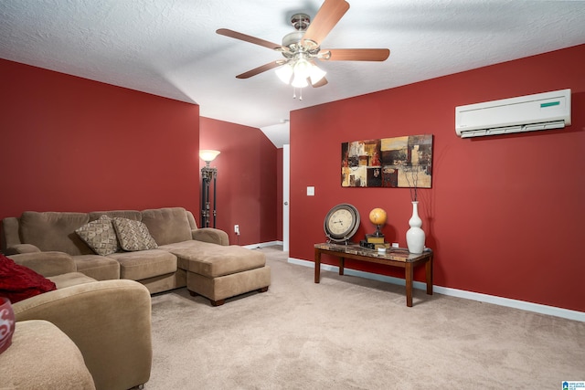 living area featuring ceiling fan, a wall mounted AC, carpet, and a textured ceiling