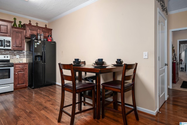 dining area with ornamental molding, dark wood-style flooring, and baseboards