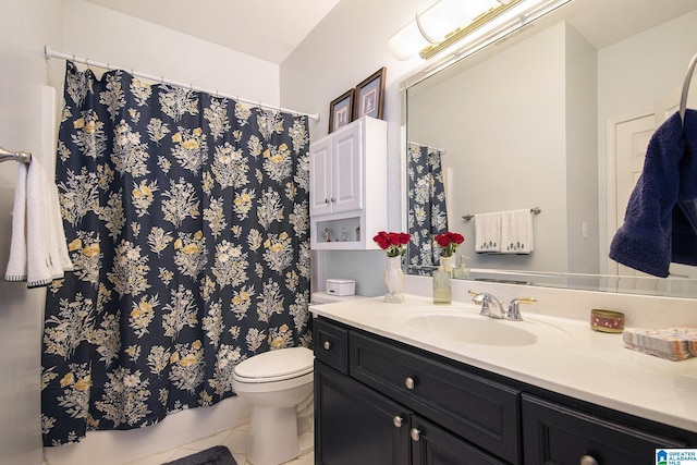 bathroom with a shower with shower curtain, vanity, toilet, and tile patterned floors