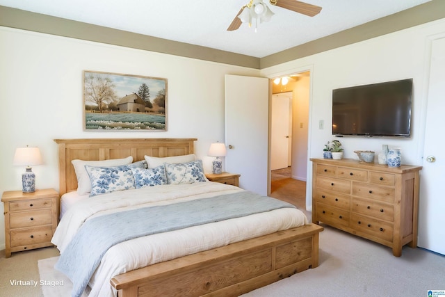 bedroom featuring a ceiling fan and light colored carpet