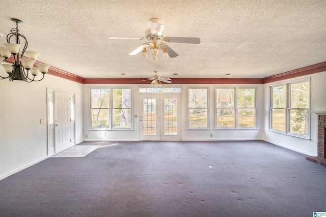 unfurnished sunroom featuring a healthy amount of sunlight and an inviting chandelier