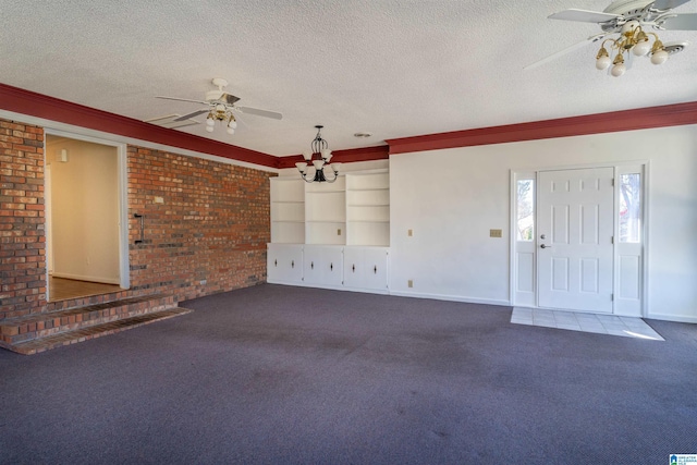 unfurnished living room with a textured ceiling, carpet flooring, and ceiling fan with notable chandelier