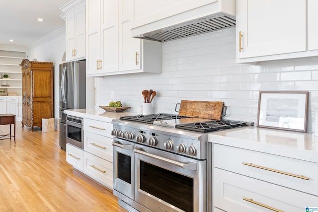 kitchen featuring premium range hood, tasteful backsplash, stainless steel appliances, crown molding, and light countertops