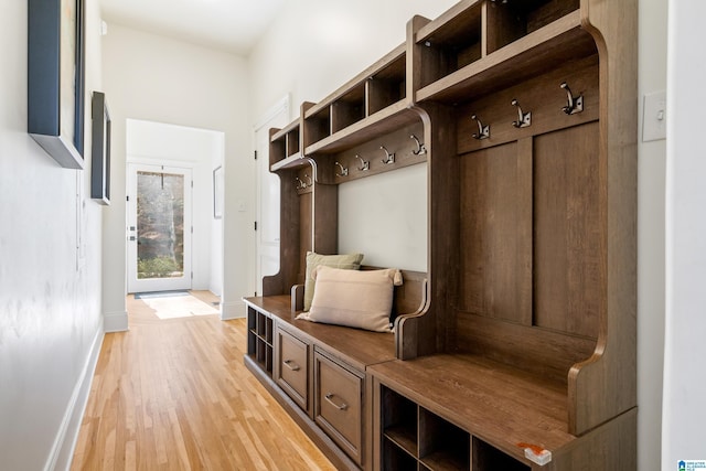 mudroom featuring baseboards and light wood-style flooring