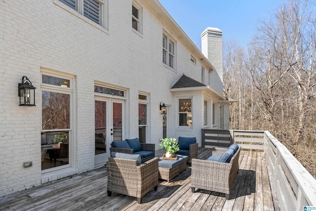 deck featuring french doors and an outdoor hangout area