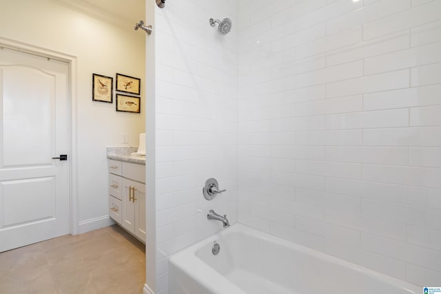 bathroom with tile patterned floors, baseboards, shower / washtub combination, and vanity