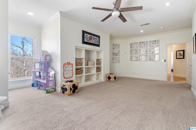 game room with visible vents, built in shelves, carpet flooring, crown molding, and baseboards