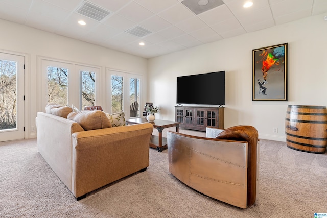 living room featuring carpet flooring, recessed lighting, visible vents, and a paneled ceiling