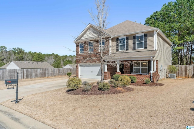 view of front facade with covered porch, a garage, brick siding, fence, and driveway