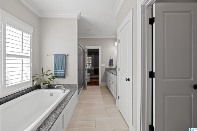 full bathroom featuring vanity, a garden tub, tile patterned flooring, ensuite bathroom, and crown molding