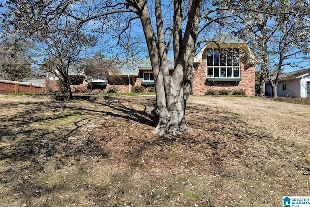 view of front facade featuring brick siding