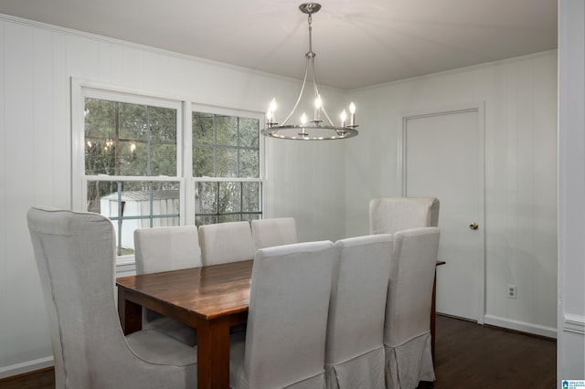 dining space with dark wood finished floors, baseboards, and ornamental molding