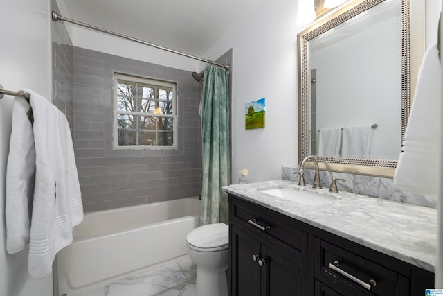 full bath with marble finish floor, shower / bath combo with shower curtain, vanity, and toilet