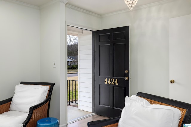 interior space featuring crown molding and wood finished floors