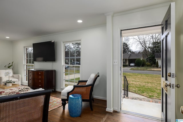 interior space with recessed lighting, ornamental molding, baseboards, and wood finished floors