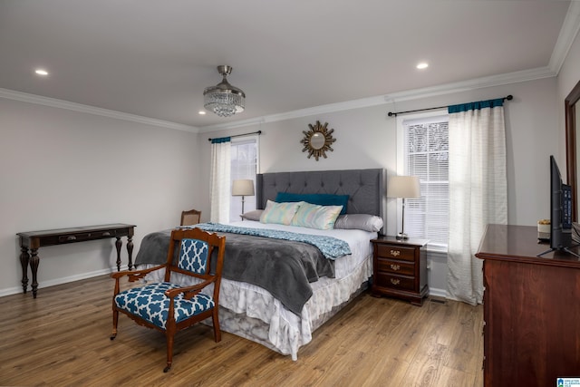 bedroom with recessed lighting, baseboards, wood finished floors, and ornamental molding