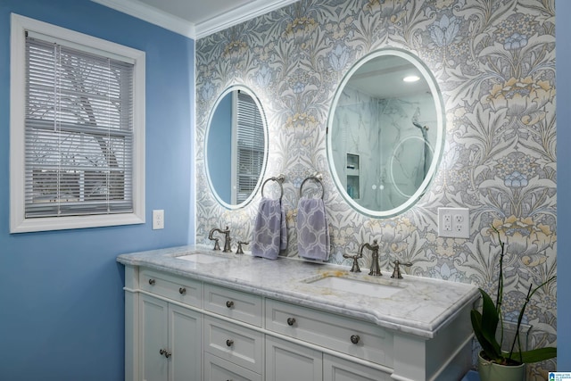 bathroom with a sink, ornamental molding, and wallpapered walls