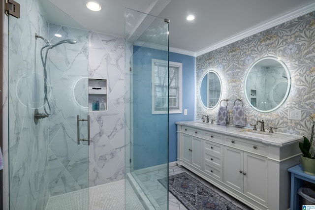 bathroom with a marble finish shower, wallpapered walls, crown molding, and a sink