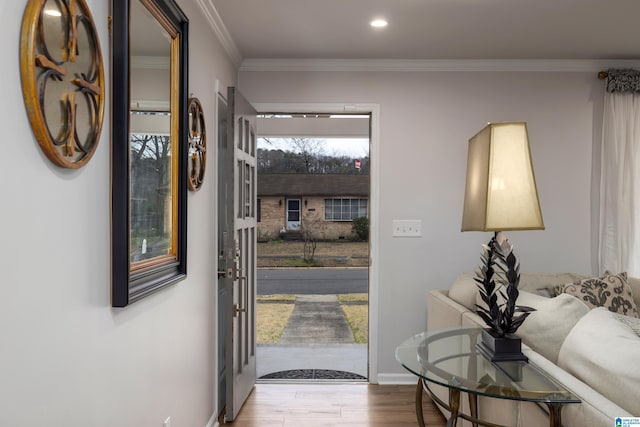 foyer featuring recessed lighting, baseboards, wood finished floors, and crown molding