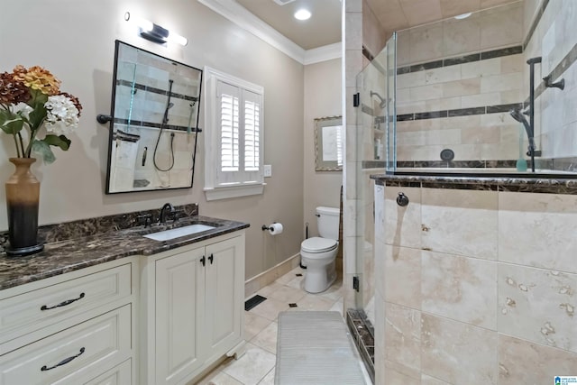 full bath featuring vanity, ornamental molding, tile patterned flooring, a shower stall, and toilet