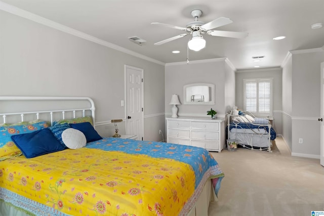 bedroom with a ceiling fan, visible vents, baseboards, carpet floors, and ornamental molding