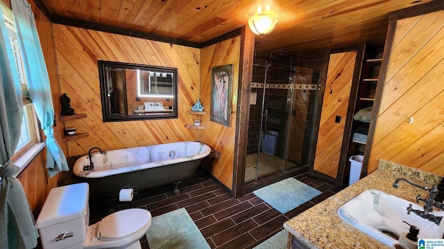 bathroom featuring wood walls, a shower stall, and toilet