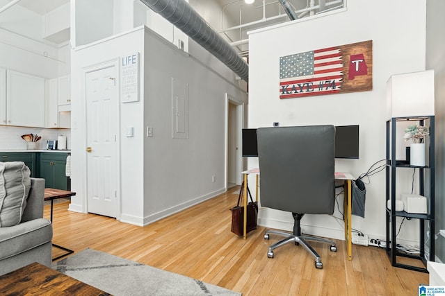300 20th Ave N Unit 204, Birmingham, AL 35203 - office space with light wood-style flooring, baseboards, and a towering ceiling