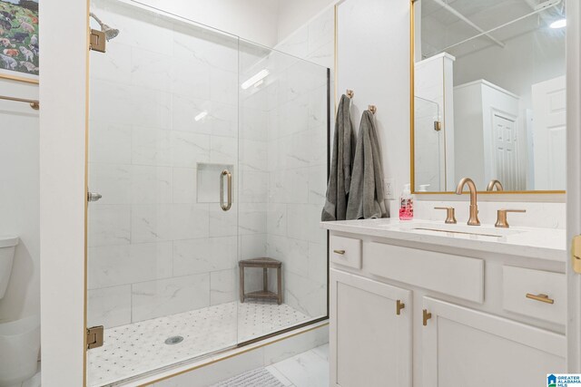 300 20th Ave N Unit 204, Birmingham, AL 35203 - full bathroom featuring a shower stall, vanity, marble finish floor, and toilet