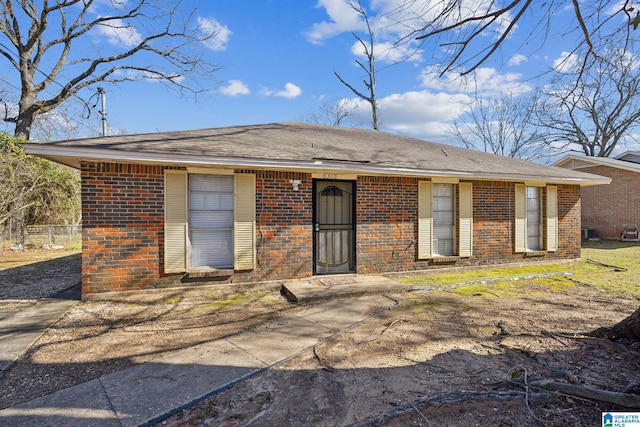 back of house featuring brick siding