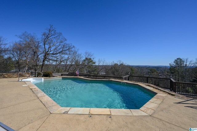 view of pool featuring a fenced in pool and a patio