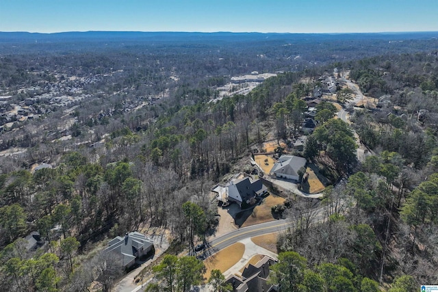 birds eye view of property with a view of trees