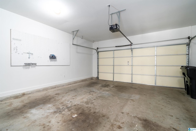 garage featuring baseboards and a garage door opener