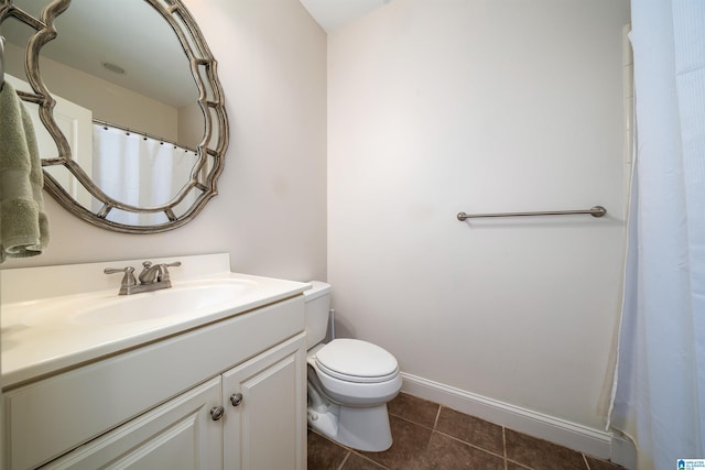 full bathroom with baseboards, vanity, toilet, and tile patterned floors