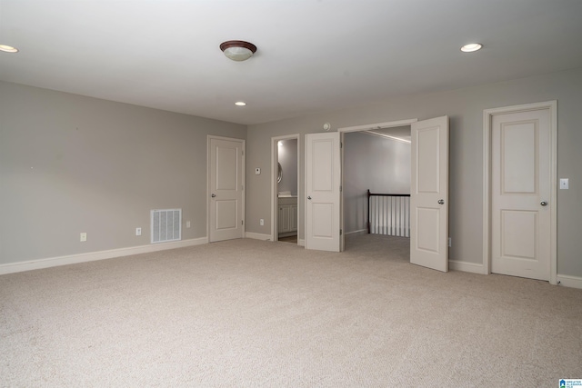 unfurnished bedroom with recessed lighting, visible vents, light carpet, and baseboards