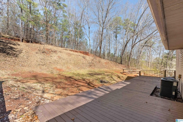 wooden terrace featuring central AC unit