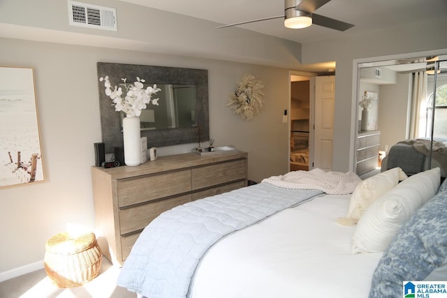 bedroom with visible vents, baseboards, and ceiling fan