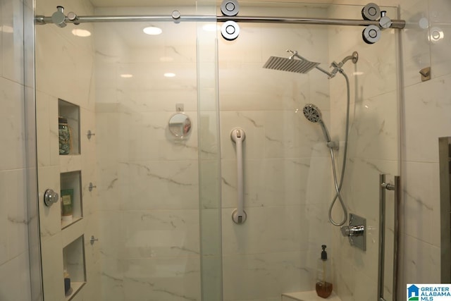 bathroom with a shower stall