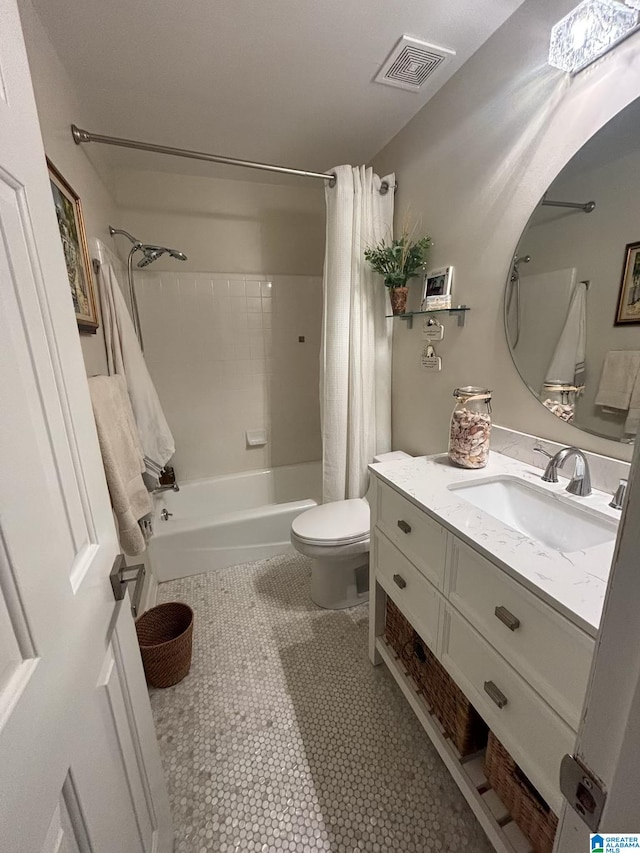 full bathroom featuring vanity, visible vents, shower / bath combo, tile patterned floors, and toilet