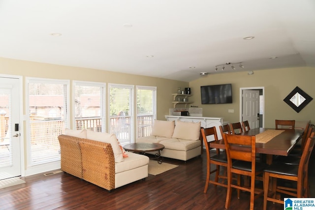 dining area featuring dark wood-type flooring and recessed lighting