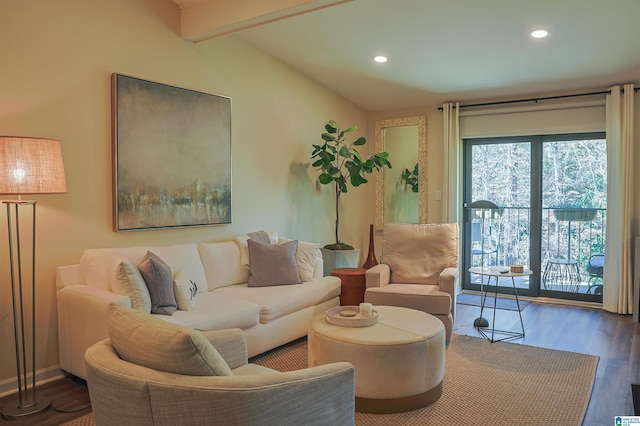 living room with recessed lighting, lofted ceiling with beams, and wood finished floors