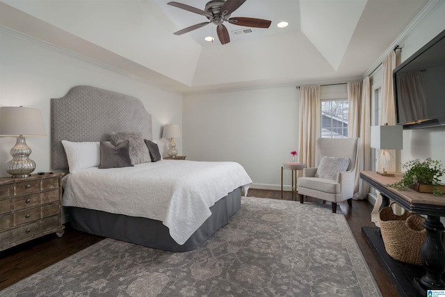 bedroom with wood finished floors, visible vents, recessed lighting, ceiling fan, and a raised ceiling